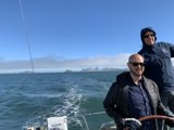 Two Men Fishing in the Shadow of San Francisco