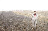 Lone Traveler on a Vast Desert Plain