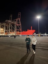 Night Stroll at Industrial Port with Red Ship