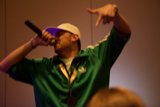 Entertainer with a Green Hat and Mic