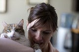Woman and Tabby Cat Share a Tender Moment