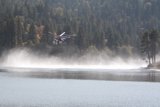 Helicopter and Fire Truck Fly Over Lake