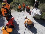 Orange-clad rock climbers