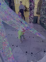 Child Explores Interactive Light Installation Display