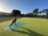 Playing Tennis on the Green Lawn