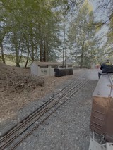 Miniature Railway Journey Through Wooded Station