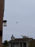 Aerial View of a House with a Helicopter and Street Light