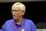 The Blue-Shirted Man with White Hair and Mustache