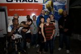 Group Poses in Front of Mighty Machine