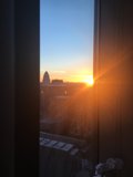 Sunset Flare over Urban Skyline
