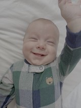 Joyful Baby's Bright Smile in Cozy Outfit