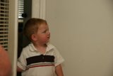 Young Boy at His Home's Doorway