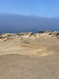 Sole Adventurer amidst a Rocky Wilderness