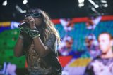 Solo Performance in Shaded Sunglasses