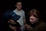 Brown Jacketed Woman Enjoying a Night Out at the Club