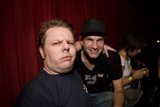 Two Men Strike a Pose at Party