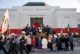 Adam Schiff and a Crowd of 28 People in Front of Historic Building
