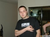 Man in Black Shirt Poses for Portrait