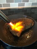 Flame-grilled Steak on a Cooking Pan