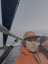 Boating Adventure Under Steel Bridge