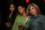 Three Women Enjoying Night Out at Pub