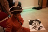 The Red Suit Man on the Wooden Floor