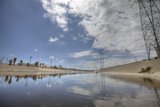 Desert Power Lines Stretch Across Blue Skies