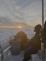 Fisherman at Sunset on Ocean Waters