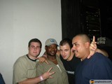 Four Men Strike a Pose at Party