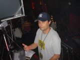 Grey-Shirted Man Sporting a Baseball Cap