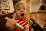Toddler's Excited Mealtime Moment at Home