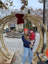 Mother and Child in Holiday Decorated Park
