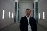 The Dapper Gentleman in an Empty Room