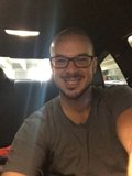 Smiling Dave B in Gray Shirt and Glasses