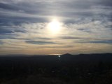 Radiant Sun over the Hillside Lake