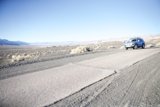 Cruising the Desert in a Blue Jeep