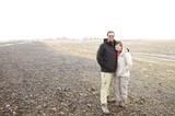 Couple Poses on Desolate Desert Road