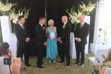 Wedding Party with Flower Arrangements