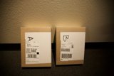 Two Cardboard Boxes with Labels