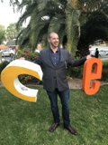 Man Standing in Front of "C" Sign in LA