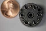 Two Metal Objects: A Penny and a Mystery Item
