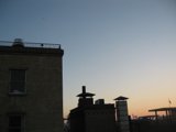 Cross Silhouette against Sunset Sky