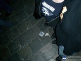 Sneakers and Handbags on Tile Floor