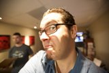 A Smiling Man with Glasses