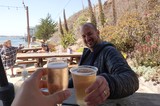 Friends Toasting Beers at Coastal Restaurant