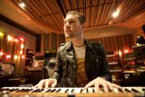 Leather-clad Man Playing Electronic Keyboard