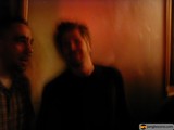 Two Men in a Dimly Lit Room