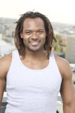 Smiling Man with Dreadlocks