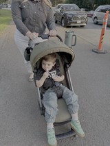 Mother and Child Strolling Through Suburban Neighborhood