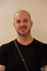 Professional Portrait of Bald Man in Black Shirt